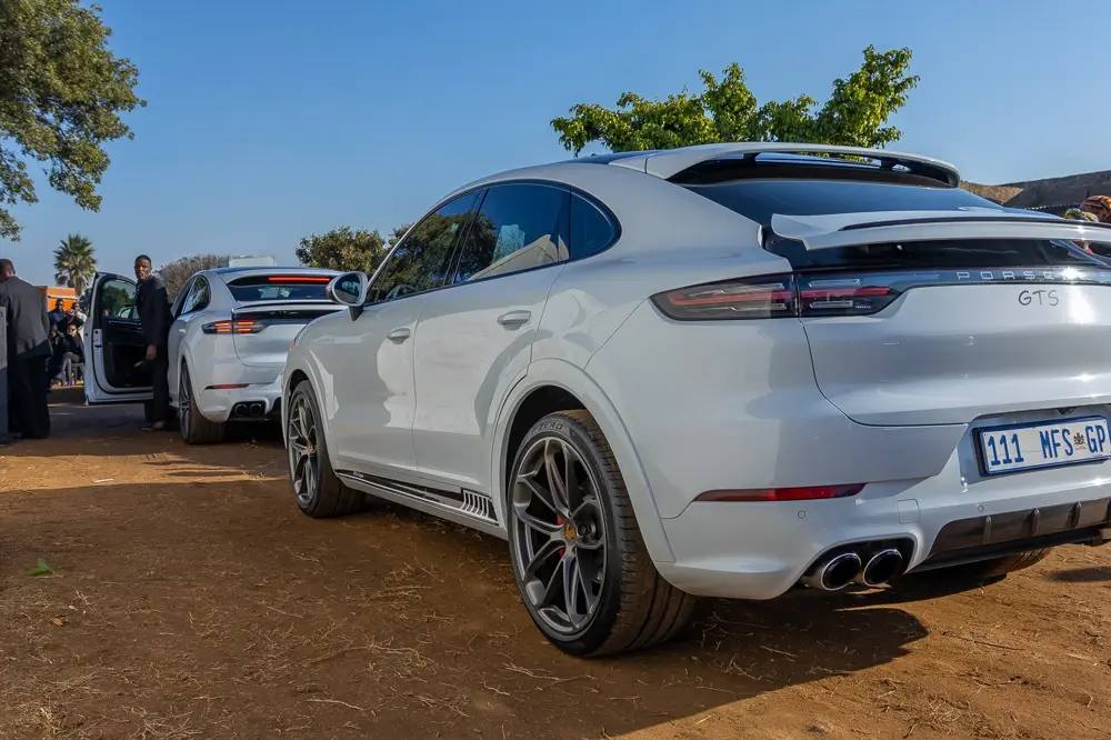 A white Mashigo Porsche Cayenne with an MFS number plate at a funeral service